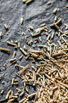 Rosemary closeup on luxury stone background as flat lay, dry food spices and recipe ingredients