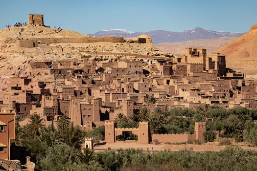 Ait Ben Haddou ksar Morocco, ancient fortress that is a Unesco Heritage site. Beautiful late afternoon light with honey, gold coloured mud brick construction the kasbah, or fortified town dates from 11th cent. and is on the former caravan route from the Sahara and Marrakech. The location has been used for many famous movies. High quality photo