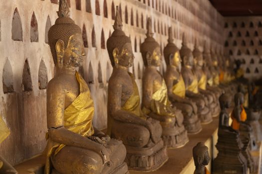 Temples at Luang Prabang Laos with Buddha statues and detailed golden shrines. High quality photo