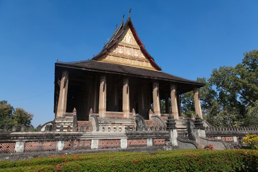 Temples at Luang Prabang Laos with Buddha statues and detailed golden shrines. High quality photo