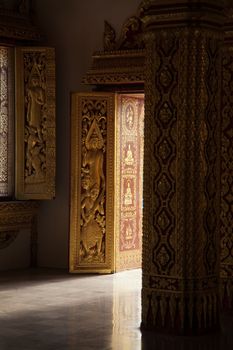 Temples at Luang Prabang Laos with Buddha statues and detailed golden shrines. High quality photo