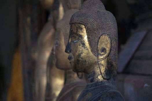 Temples at Luang Prabang Laos with Buddha statues and detailed golden shrines. High quality photo