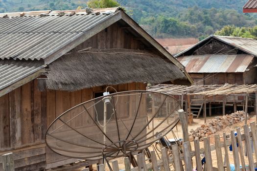 Ban Napia near Phonsavan Laos village houses where people make spoons from bombs leftover from Vietnam war and use empty bomb casings . High quality photo