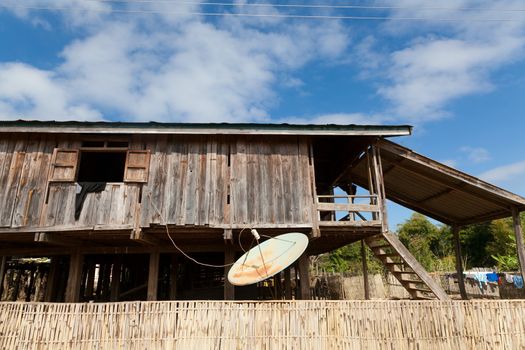 Ban Napia near Phonsavan Laos village houses where people make spoons from bombs leftover from Vietnam war and use empty bomb casings . High quality photo