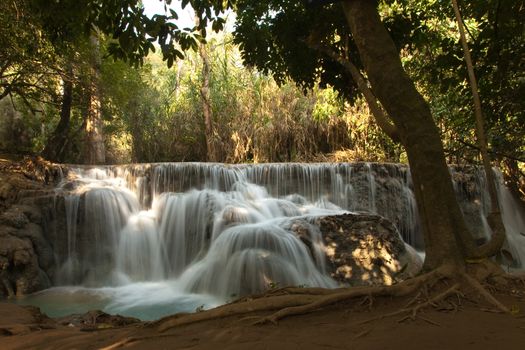 Kuang Si Falls Laos, famous waterfalls in the jungle with beautiful landscape. High quality photo