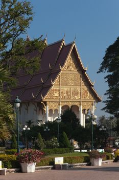 Temples at Luang Prabang Laos with Buddha statues and detailed golden shrines. High quality photo
