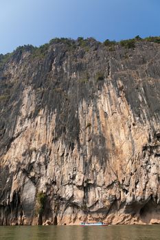 Nam Ou River, boats and landscape with mountains and riverside villages. High quality photo