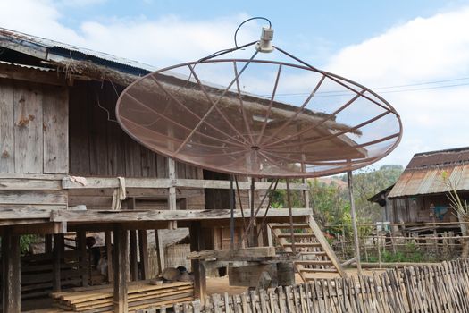 Ban Napia near Phonsavan Laos village houses where people make spoons from bombs leftover from Vietnam war and use empty bomb casings . High quality photo