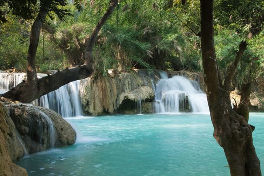 Kuang Si Falls Laos, famous waterfalls in the jungle with beautiful landscape. High quality photo