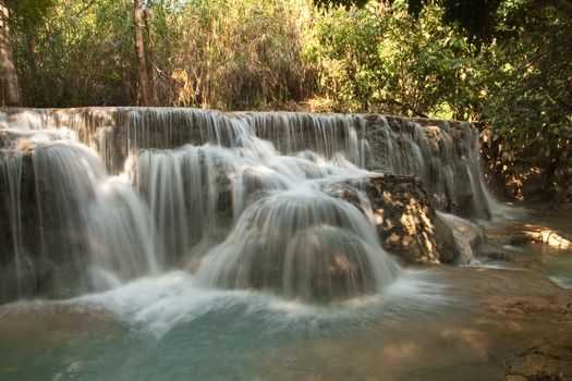 Kuang Si Falls Laos, famous waterfalls in the jungle with beautiful landscape. High quality photo