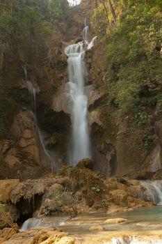 Kuang Si Falls Laos, famous waterfalls in the jungle with beautiful landscape. High quality photo