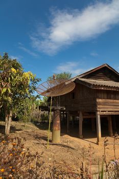 Ban Napia near Phonsavan Laos village houses where people make spoons from bombs leftover from Vietnam war and use empty bomb casings . High quality photo