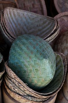 Laos, wicker woven baskets and containers in market, patterned weaving. High quality photo