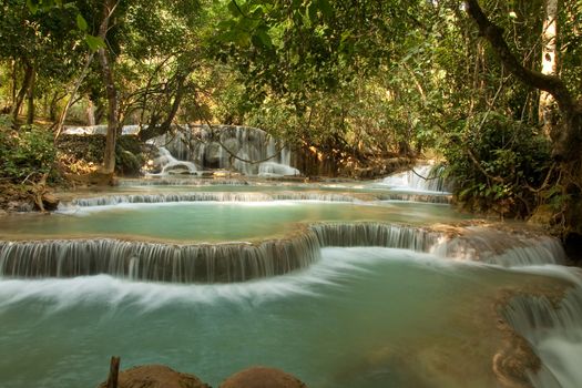 Kuang Si Falls Laos, famous waterfalls in the jungle with beautiful landscape. High quality photo