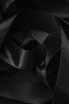 Black silk ribbon as background, abstract and luxury brand designs