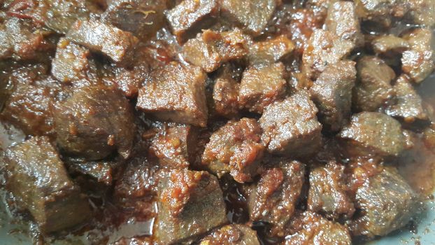 A close up view of Stewed chicken liver withspices  on it, a traditional home made delicious liver dish