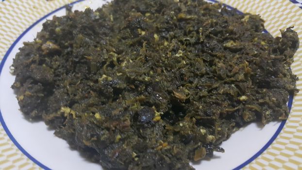 Close up view of delicious traditional fresh spinach leaves or vegetables cooked dish, delicious food also called paalak saag, food background for text