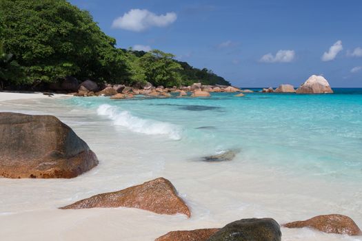 Seychelles with a turqouise water and big stones and lot of green plants