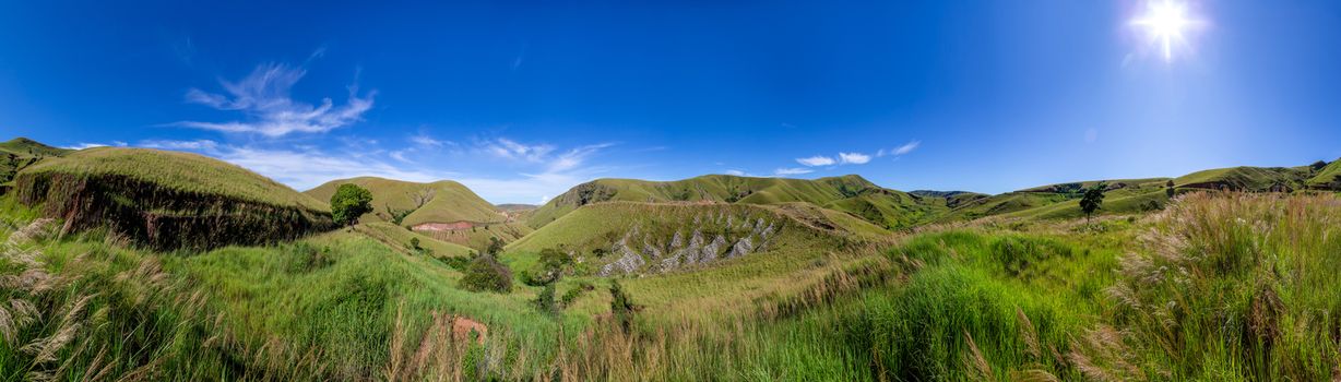 A landscape pictures of the country of Madagascar, with mountains and meadows