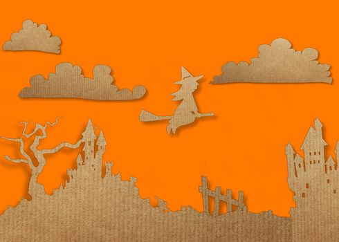 Modern paper cut flat lay with witch and orange halloween background.
Halloween day concept.