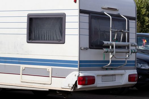 Caravan trailer, mobile home for family travel, close-up. Camping concept, hyper-local travel, family outings.