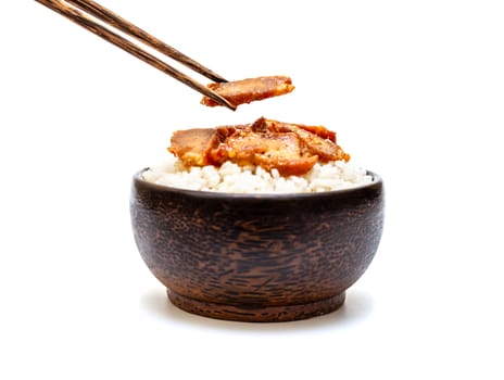 White rice with grilled pork and chopsticks in black bowl on white background, Rice from asia, Rice food of asian style