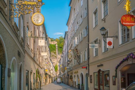 Salzburg, Austria - August 13, 2018:  Getreidegasse street - famous shopping street in Salzburg old town.