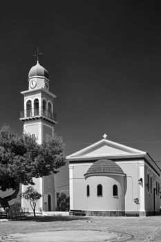 Orthodox church with a bell tower on the island of Kefalonia in Greece, black and white