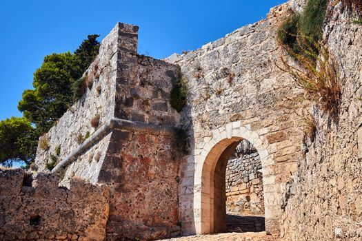 Stone gate of the medieval Venetian St George's castle on the island of Kefalonia in Greece