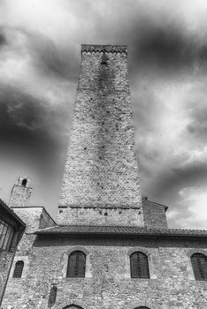 View of Torre Grossa, the tallest medieval tower and one of the main attractions in the central square of San Gimignano, Tuscany, Italy