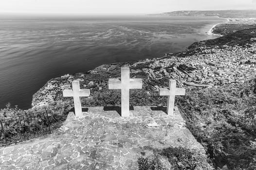 The iconic Three Crosses on the top of Mount Sant'Elia overlooking the town of Palmi on the Tyrrhenian Sea, Italy