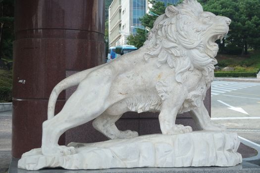 White lion statue background with copy space for text