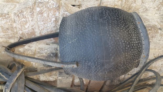 Closeup of hanging leather water bags made from automobile tires recycling. This leather water bad is called mashkeeza and used in olden days for carrying water in desserts