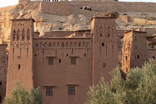 Ait Ben Haddou ksar Morocco, ancient fortress that is a Unesco Heritage site. Beautiful late afternoon light with honey, gold coloured mud brick construction the kasbah, or fortified town dates from 11th cent. and is on the former caravan route from the Sahara and Marrakech. The location has been used for many famous movies. High quality photo