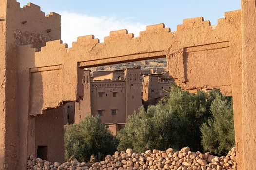 Ait Ben Haddou ksar Morocco, ancient fortress that is a Unesco Heritage site. Beautiful late afternoon light with honey, gold coloured mud brick construction the kasbah, or fortified town dates from 11th cent. and is on the former caravan route from the Sahara and Marrakech. The location has been used for many famous movies. High quality photo