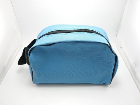 Blue portable hand bag with sling use to put stuffs inside