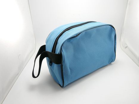 Blue portable hand bag with sling use to put stuffs inside