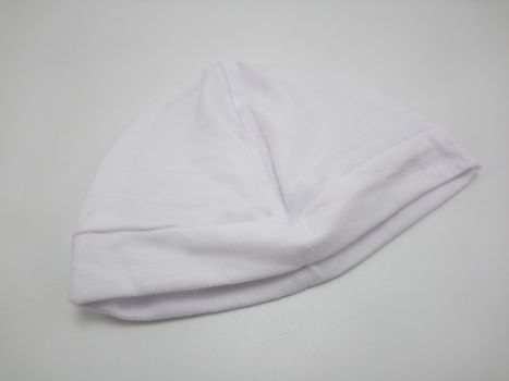 White plain baby head bonnet use to cover the head of person during cold condition