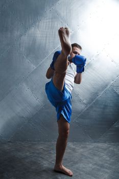 Sportsman muay thai man boxer stance posing.