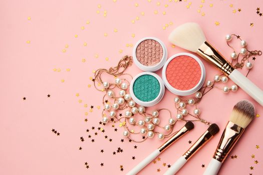 cosmetic accessories eyeshadow accessories makeup brushes merchandise collection professional cosmetics on pink background.