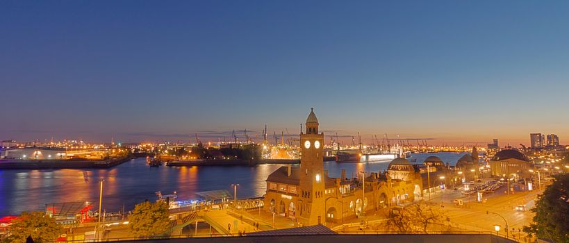 A panorama of the Hamburg Harbor after sunset