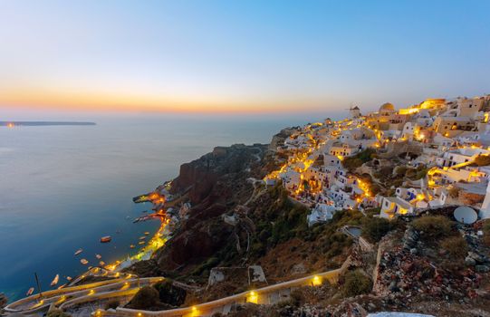 Oia and the port of Ammoudi on santorini island after sunset