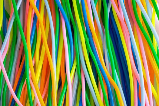 A background from colourful plastic toy cables