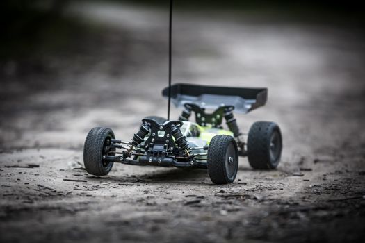An offroad radio controlled car in action in rural bushland in Victoria, Australia