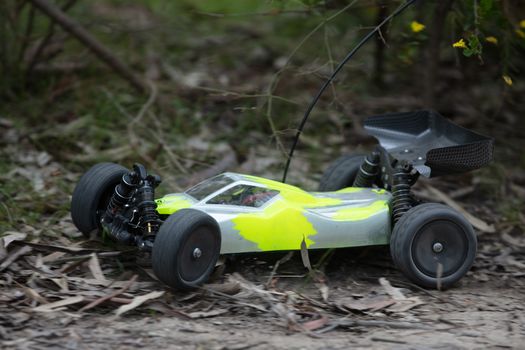 An offroad radio controlled car in action in rural bushland in Victoria, Australia