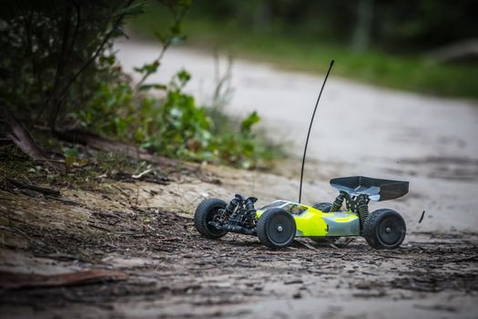 An offroad radio controlled car in action in rural bushland in Victoria, Australia