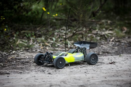 An offroad radio controlled car in action in rural bushland in Victoria, Australia