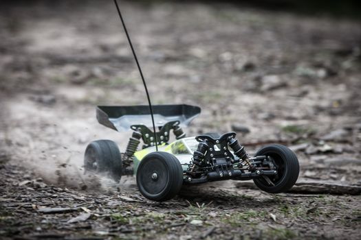 An offroad radio controlled car in action in rural bushland in Victoria, Australia