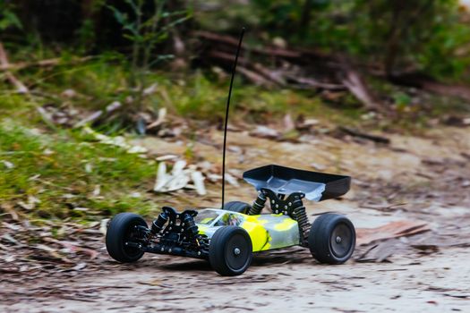 An offroad radio controlled car in action in rural bushland in Victoria, Australia