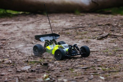 An offroad radio controlled car in action in rural bushland in Victoria, Australia